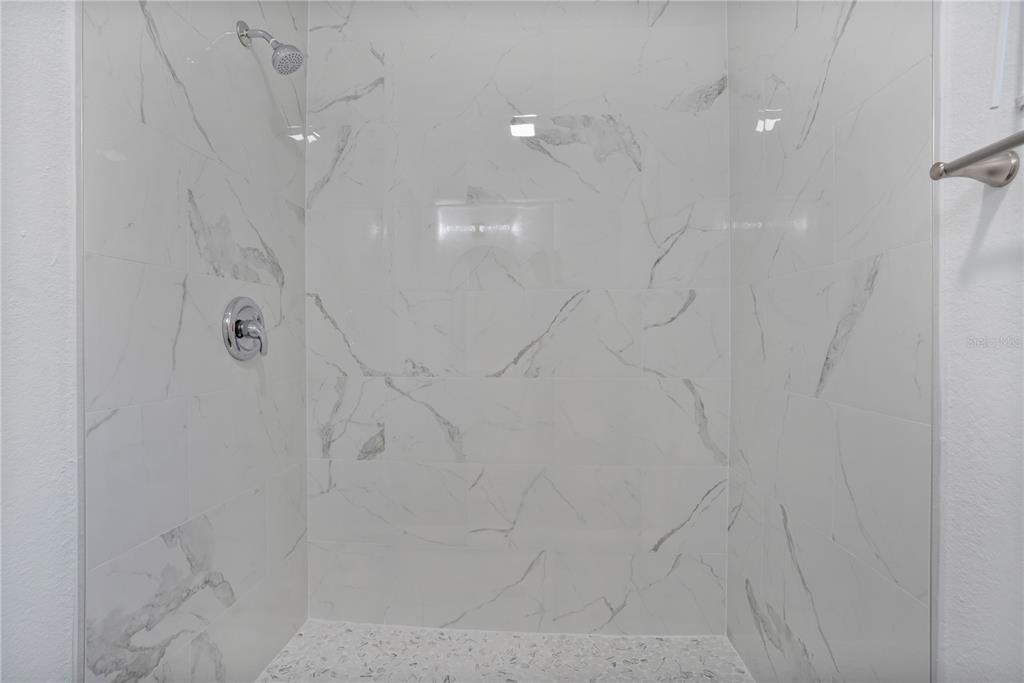 1213 Baranova Road Ocoee, FL 34761 - Photo 22 of 31 a bathroom with a shower