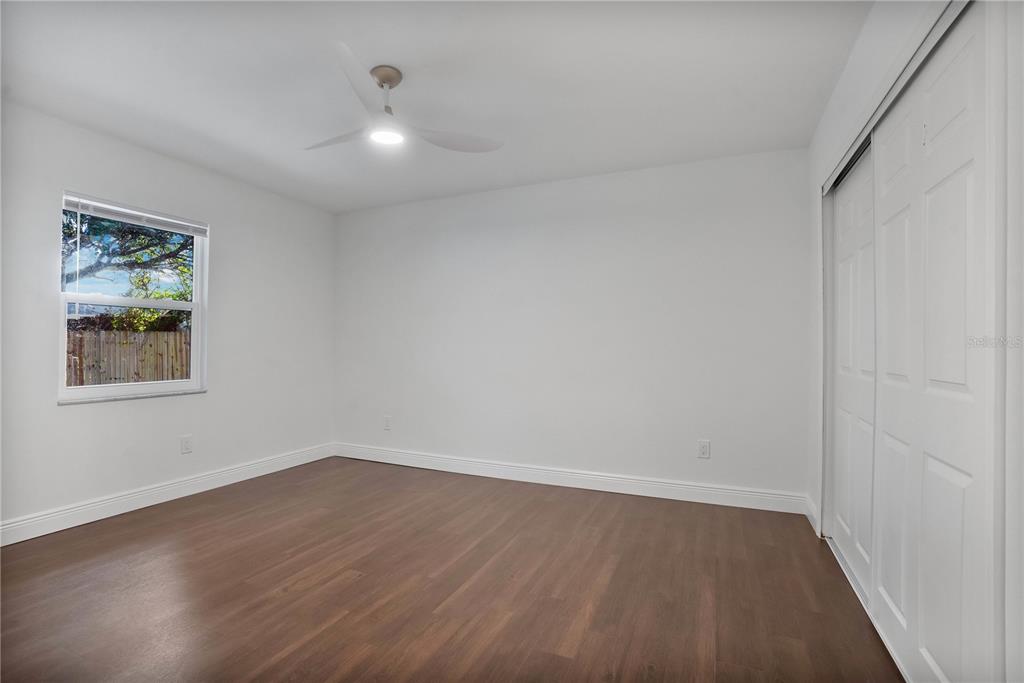 1213 Baranova Road Ocoee, FL 34761 - Photo 23 of 31 wooden floor in an empty room with a window