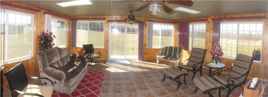 1022 Winter Mountain Road Andreas, PA 18211 - Photo 8 of 25 Sun Room with sky lights and tile flooring.