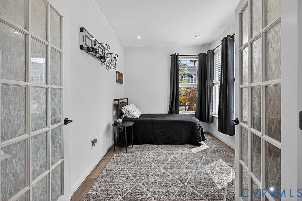 18517 Palisades Ridge Moseley, VA 23120 - Photo 15 of 55 a bedroom with a large bed and a window