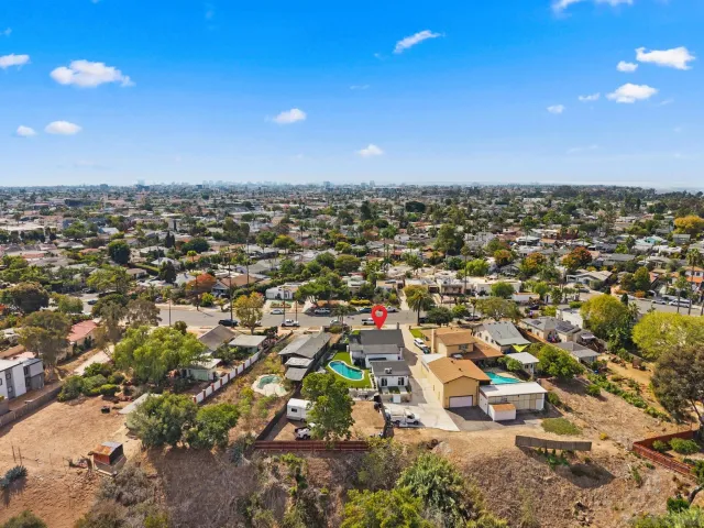 a view of pool with a yard
