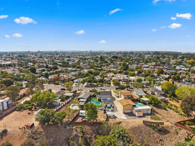 an aerial view of a city with lots of residential buildings