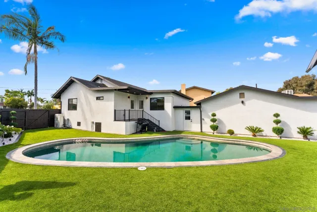 a view of swimming pool with a patio