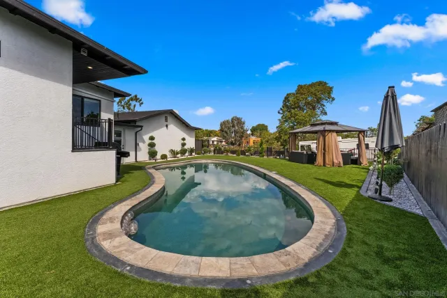 a view of a swimming pool with a patio