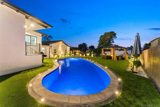 a bedroom with furniture and a rug