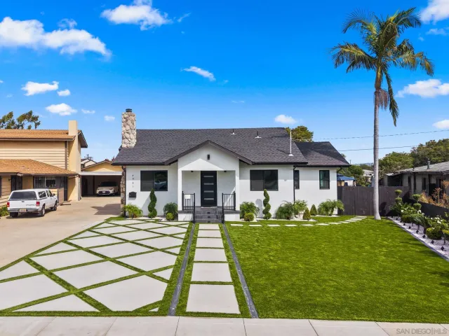 a kitchen with stainless steel appliances kitchen island granite countertop a stove a sink and a microwave