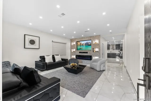 a kitchen with stainless steel appliances kitchen island granite countertop a sink and cabinets