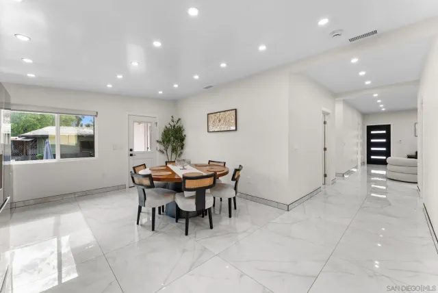 a kitchen with stainless steel appliances kitchen island granite countertop a sink and cabinets