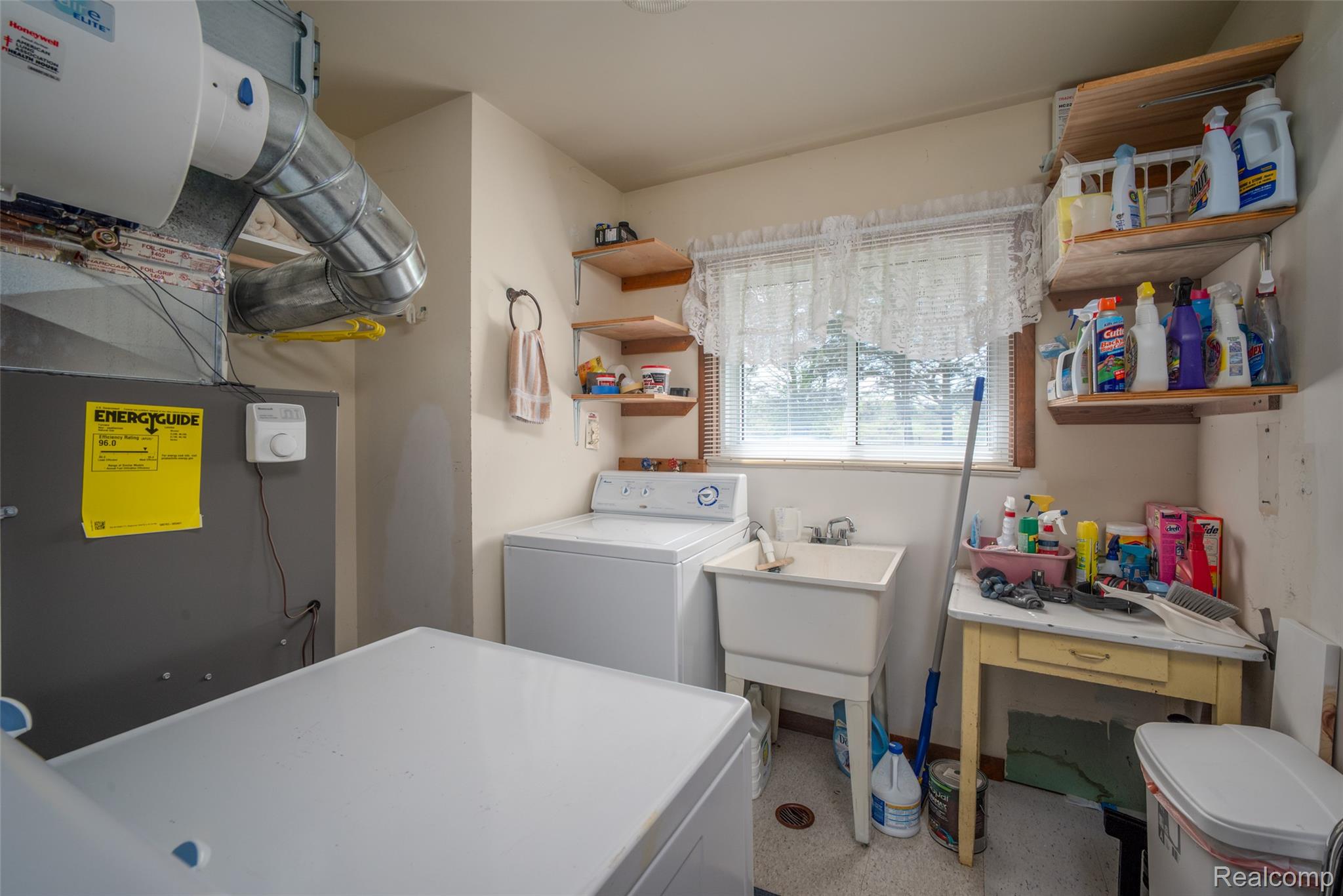 6240 Lakeshore Road Palms, MI 48465 - Photo 23 of 38 Laundry area with washer / dryer and heating unit