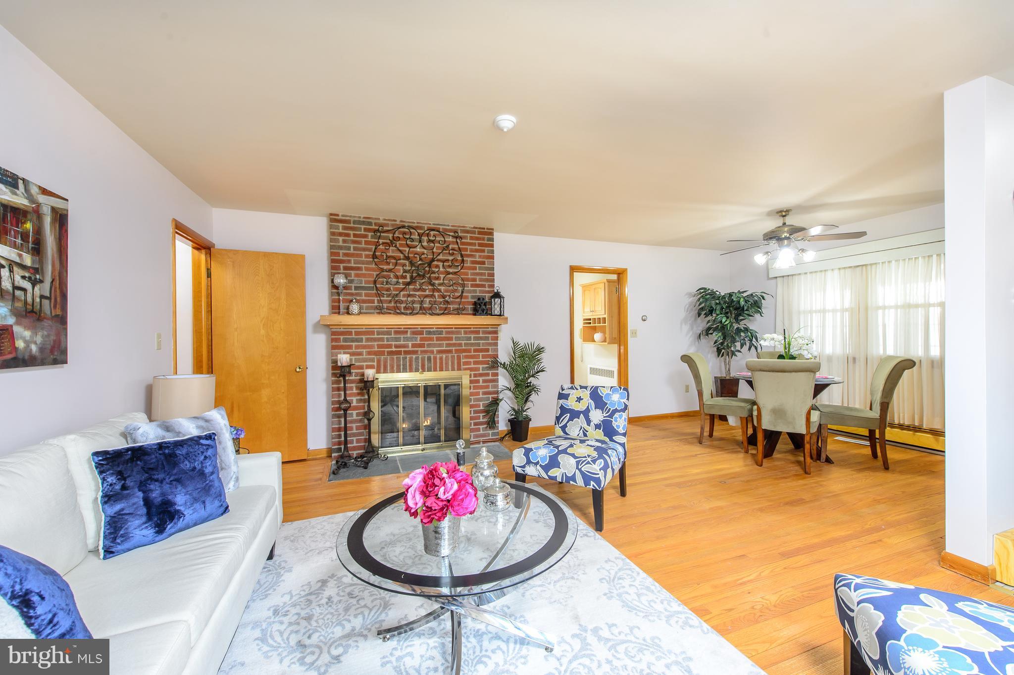 25229 Woodfield Road Damascus, MD 20872 - Photo 5 of 30 a living room with furniture and a table