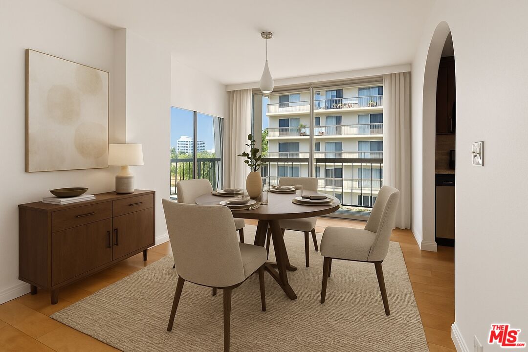 10747 Wilshire Boulevard, Unit 805 Los Angeles, CA 90024 - Photo 3 of 14 a view of a dining room with furniture and wooden floor