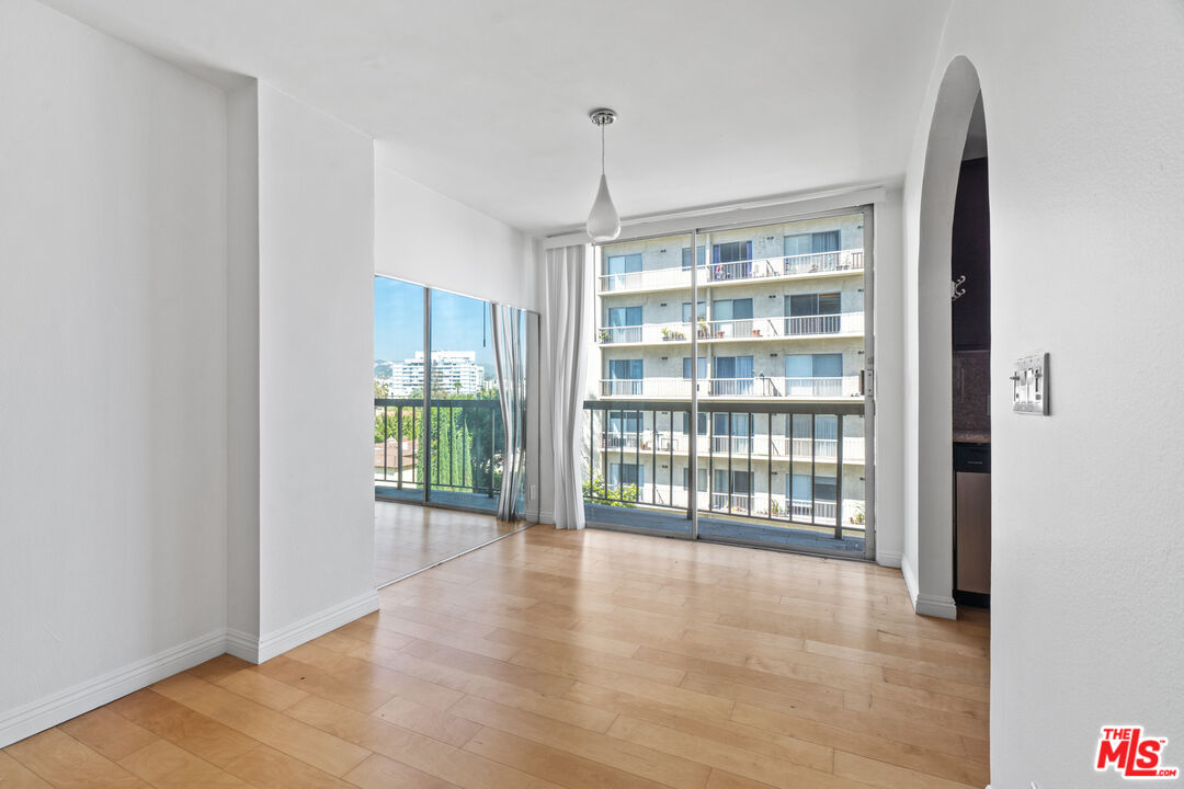 10747 Wilshire Boulevard, Unit 805 Los Angeles, CA 90024 - Photo 4 of 14 a view of an empty room with a window