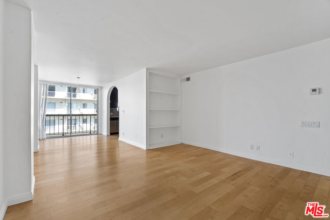 10747 Wilshire Boulevard, Unit 805 Los Angeles, CA 90024 - Photo 7 of 14 a view of an empty room with a window