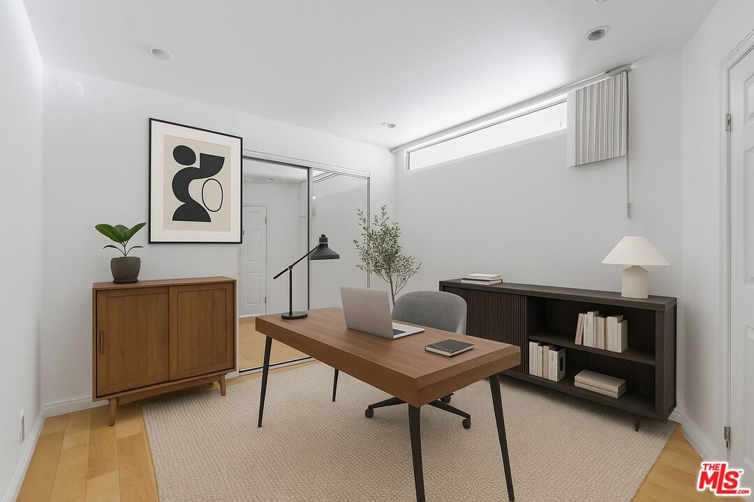 10747 Wilshire Boulevard, Unit 805 Los Angeles, CA 90024 - Photo 9 of 14 a view of a livingroom with furniture and workspace