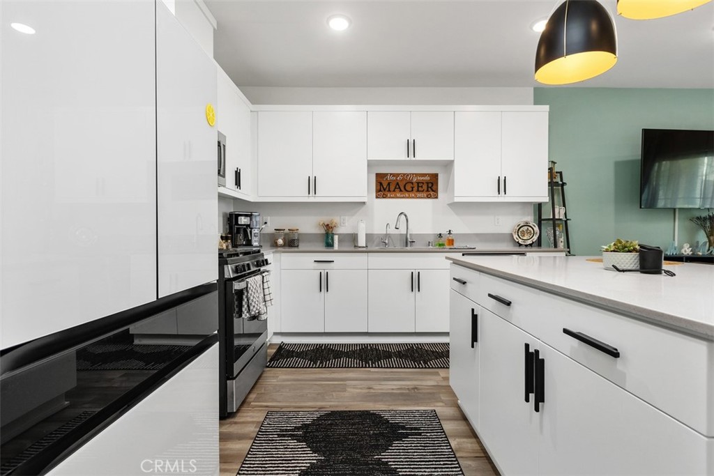 344 Zest Lane Fallbrook, CA 92028 - Photo 11 of 36 a kitchen with a sink stove and cabinets