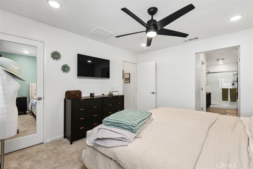 344 Zest Lane Fallbrook, CA 92028 - Photo 17 of 36 a bedroom with a bed and a flat screen tv