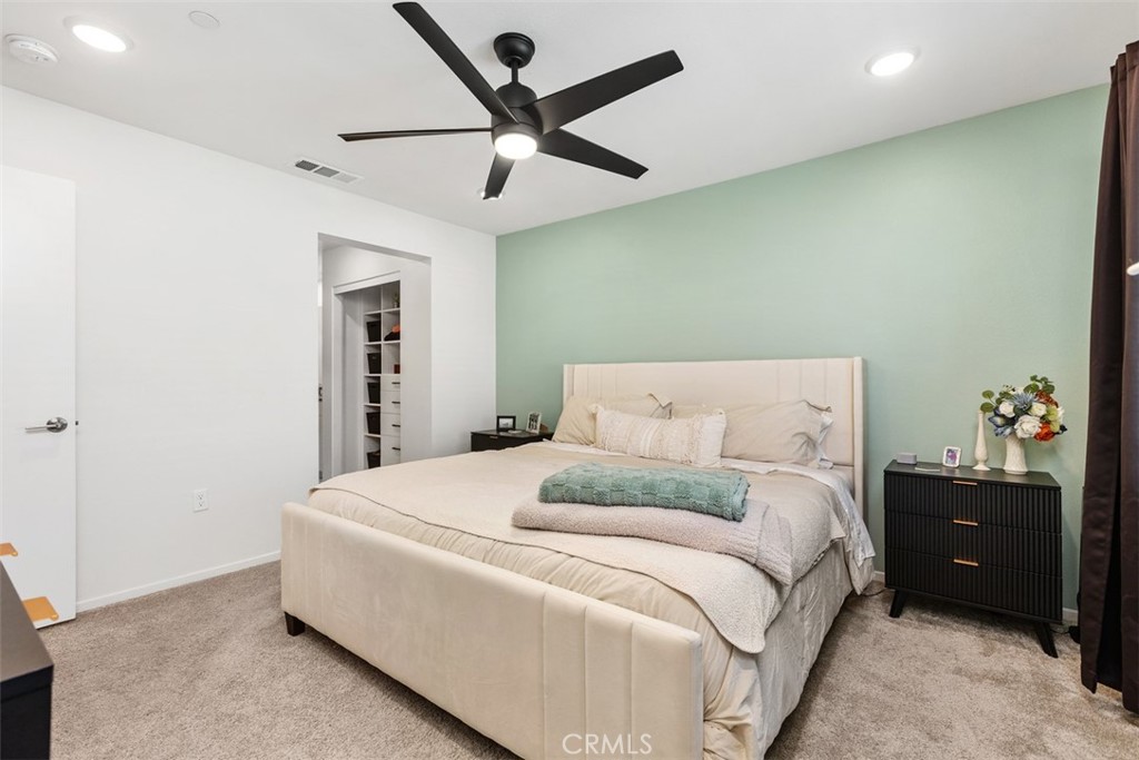 344 Zest Lane Fallbrook, CA 92028 - Photo 18 of 36 a bedroom with a bed and a ceiling fan