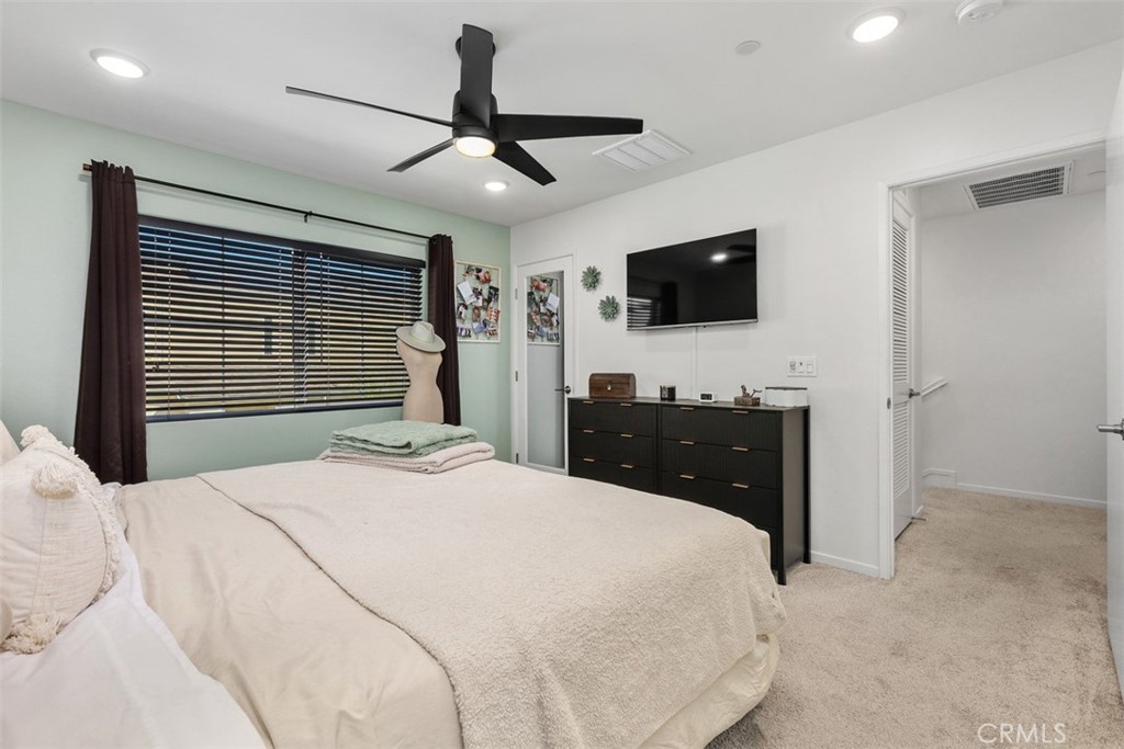 344 Zest Lane Fallbrook, CA 92028 - Photo 19 of 36 a bedroom with a bed and a flat screen tv