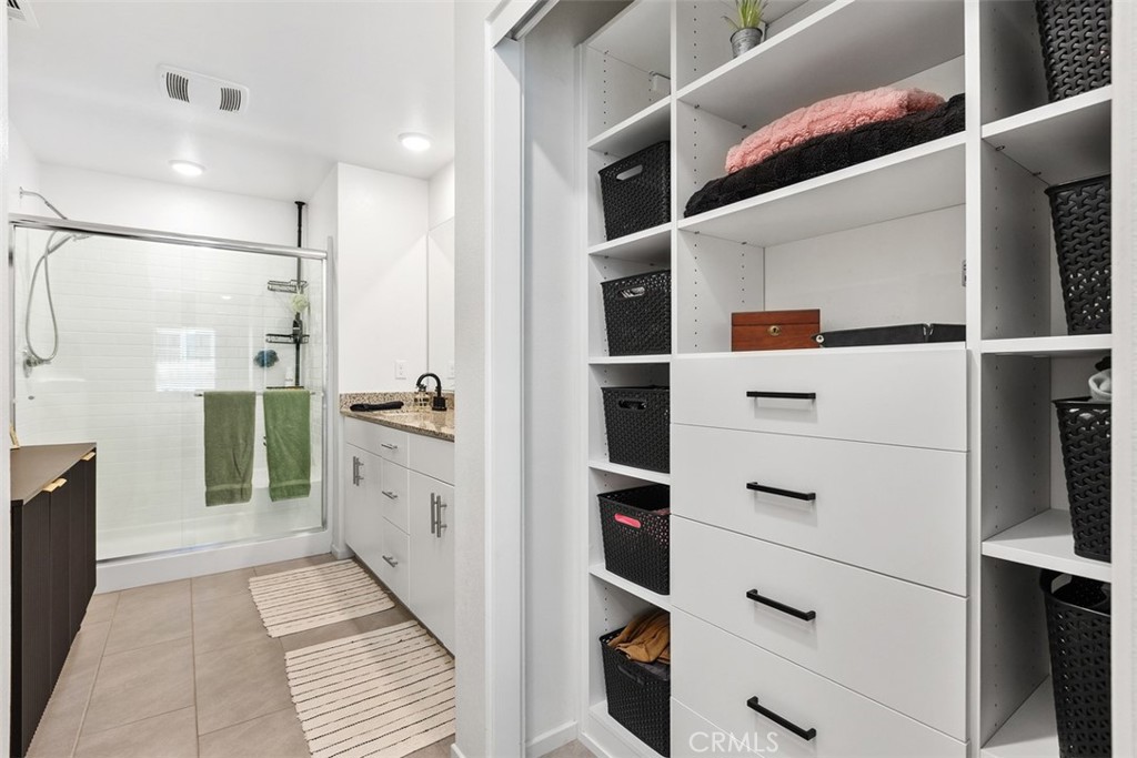 344 Zest Lane Fallbrook, CA 92028 - Photo 20 of 36 a bathroom with a double vanity sink a toilet and shower