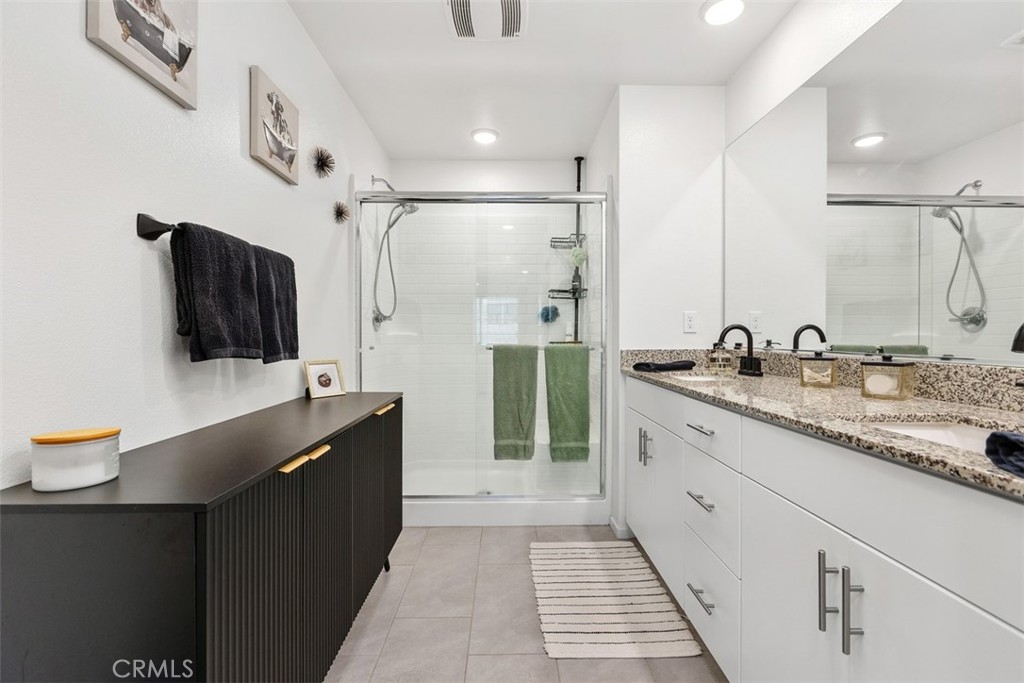 344 Zest Lane Fallbrook, CA 92028 - Photo 21 of 36 a spacious bathroom with a double vanity sink mirror and shower
