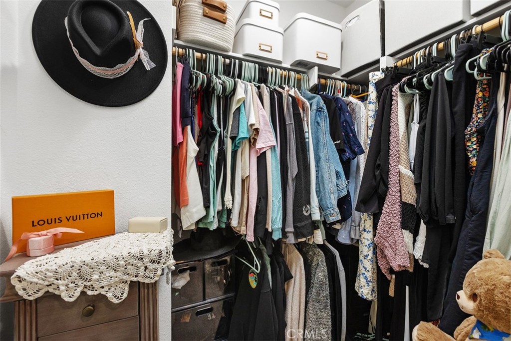 344 Zest Lane Fallbrook, CA 92028 - Photo 25 of 36 a view of walk in closet with clothes and shoes