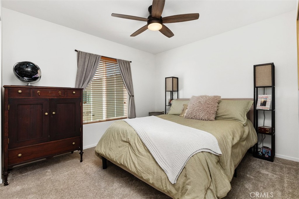 344 Zest Lane Fallbrook, CA 92028 - Photo 27 of 36 a bedroom with a bed and window