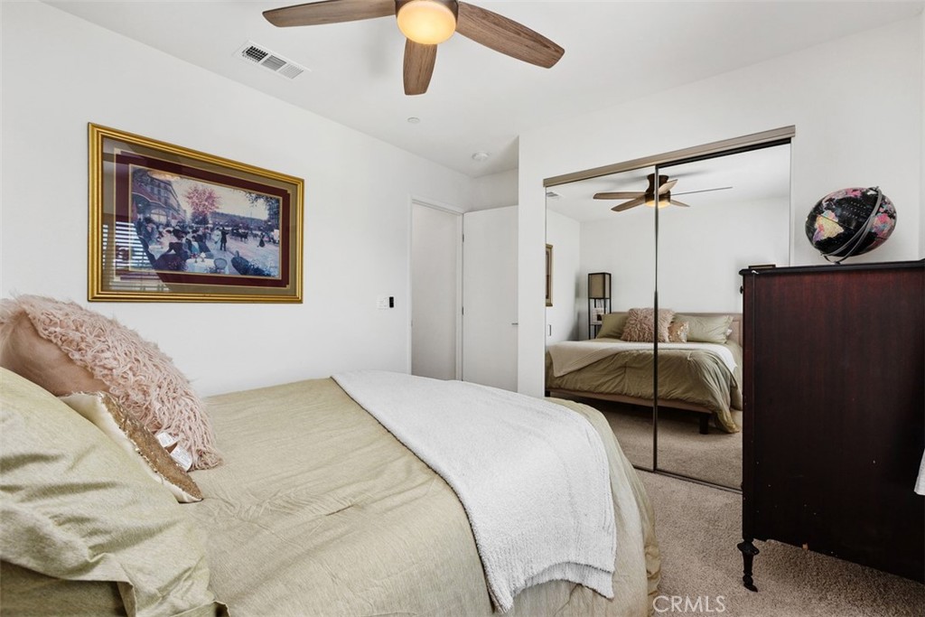 344 Zest Lane Fallbrook, CA 92028 - Photo 28 of 36 a bedroom with a bed and a painting on the wall