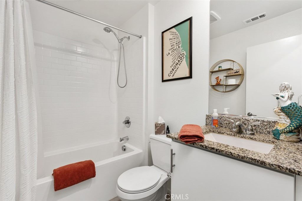 344 Zest Lane Fallbrook, CA 92028 - Photo 29 of 36 a bathroom with a granite countertop toilet sink vanity tub and shower