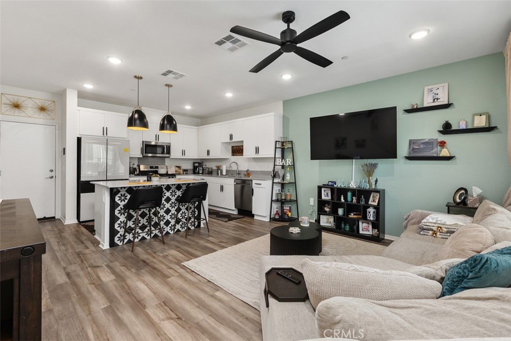 344 Zest Lane Fallbrook, CA 92028 - Photo 6 of 36 a living room with furniture and a flat screen tv