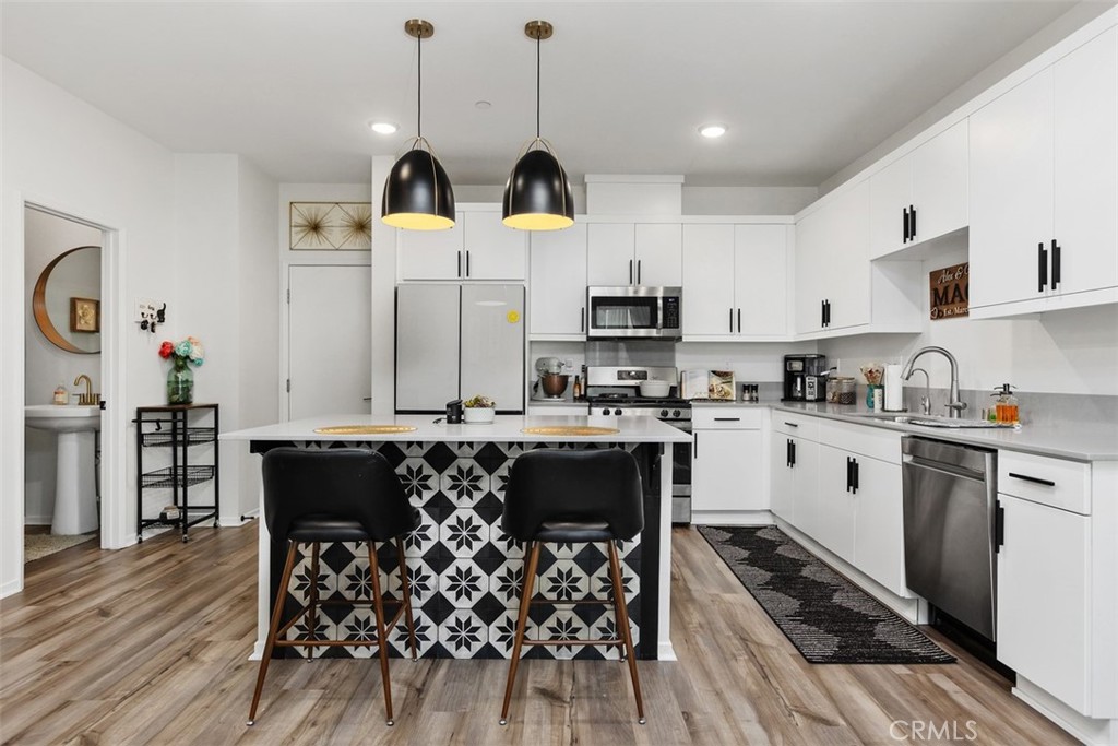 344 Zest Lane Fallbrook, CA 92028 - Photo 9 of 36 a kitchen with stainless steel appliances a stove a sink and a refrigerator