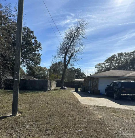 a house view with a backyard space