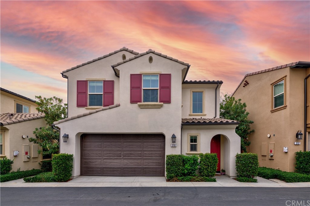 a front view of a house with garage