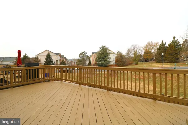 a view of a balcony with wooden floor