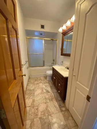a bathroom with a sink a mirror and a bathtub