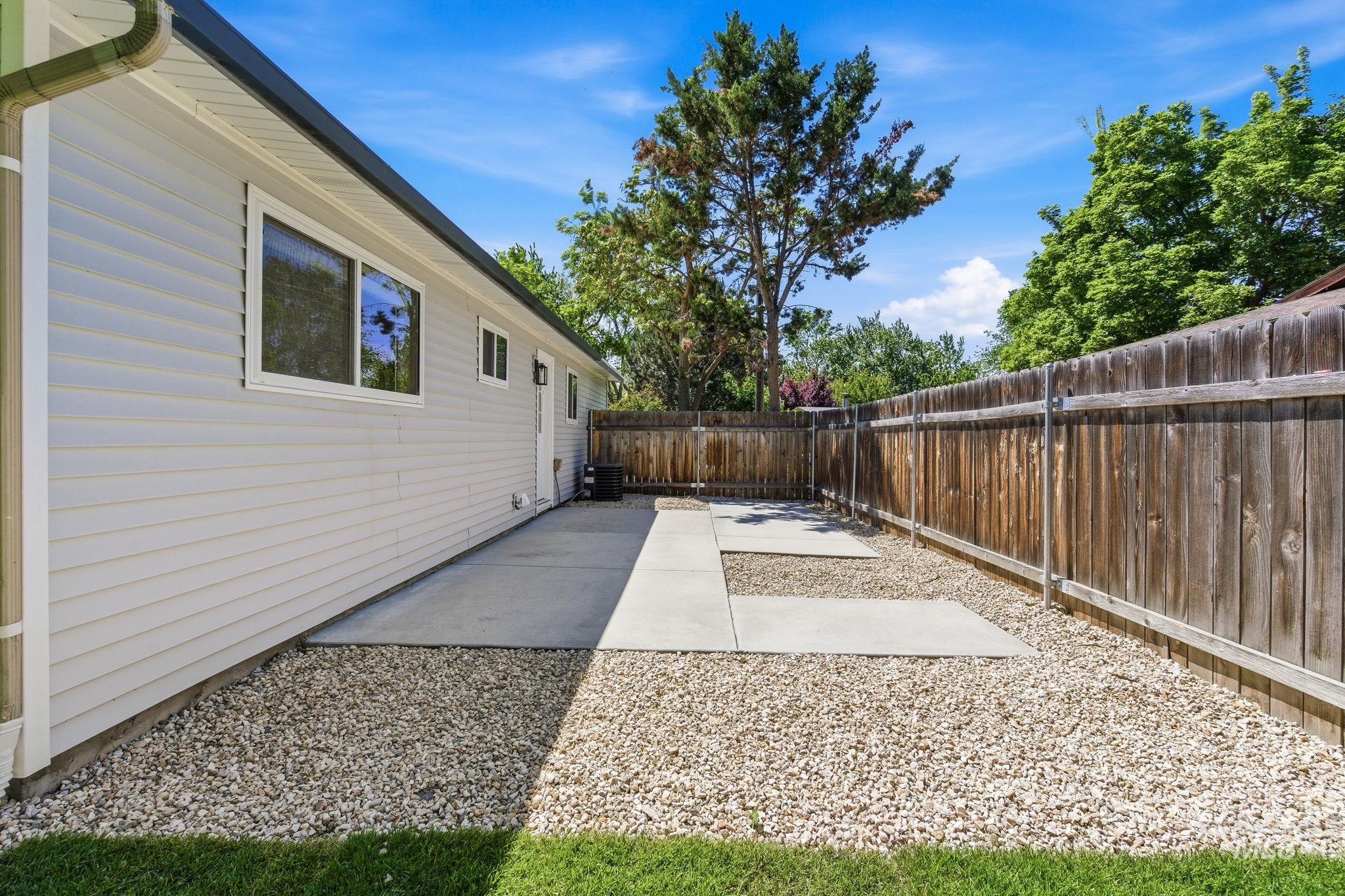 2224 Rachel Circle Boise, ID 83706 - Photo 46 of 50 Private backyard featuring a wooden fence, gravel landscaping, and concrete patio areas