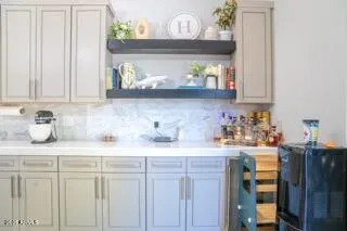 a kitchen with stainless steel appliances granite countertop a sink and wooden cabinets