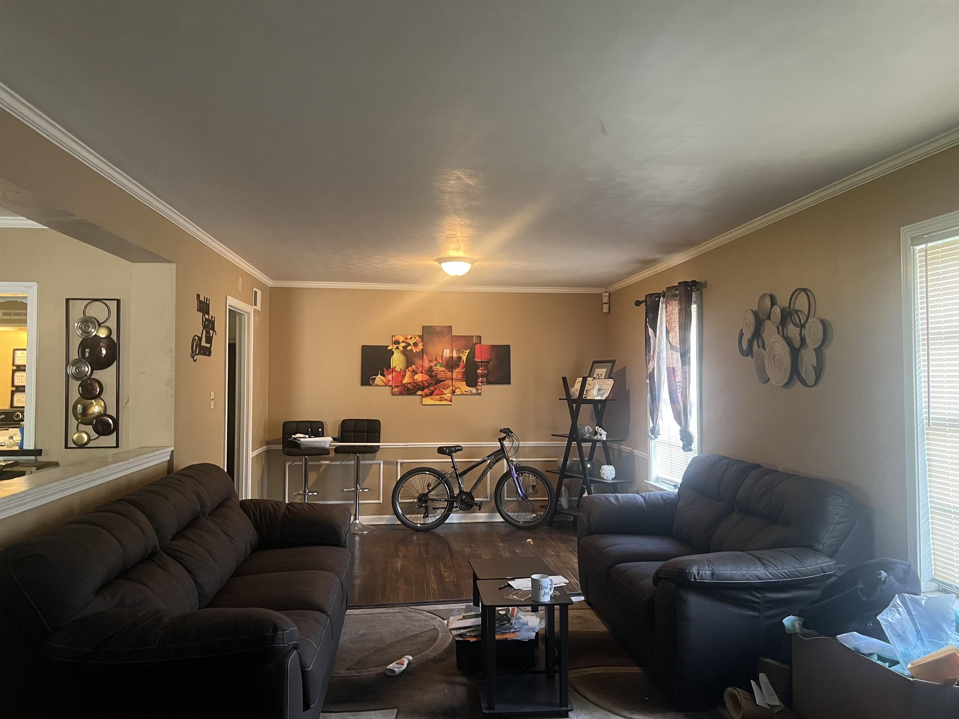 5466 Cottonwood Road Memphis, TN 38115 - Photo 4 of 5 a living room with furniture and a flat screen tv