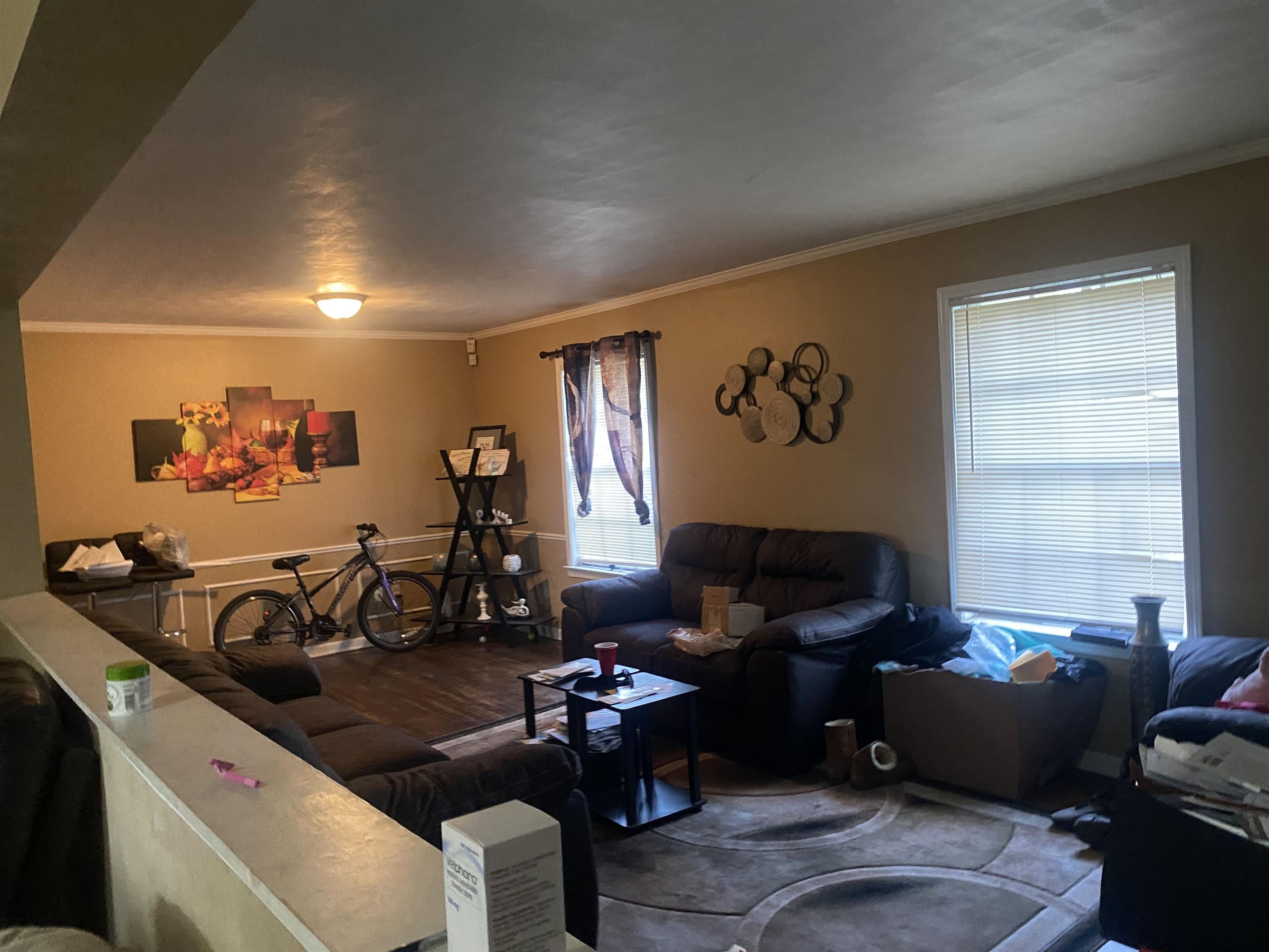 5466 Cottonwood Road Memphis, TN 38115 - Photo 5 of 16 a living room with furniture and a flat screen tv