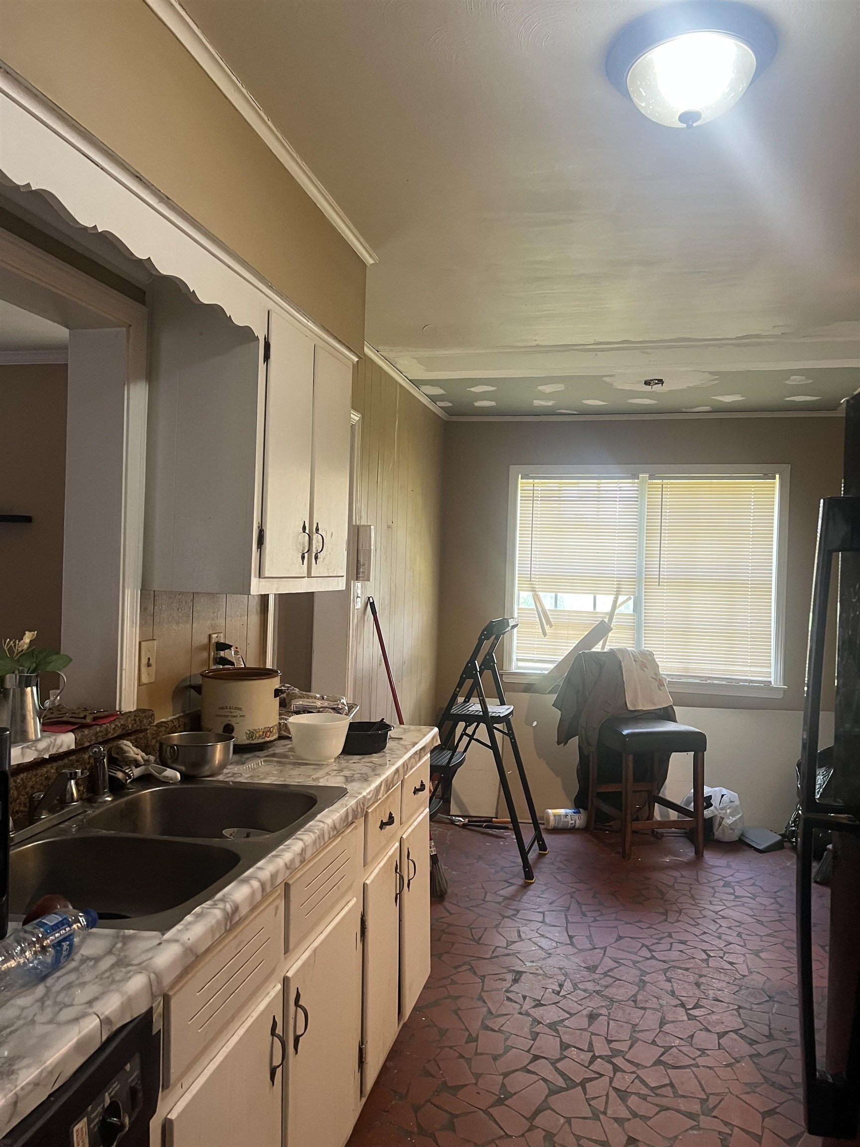 5466 Cottonwood Road Memphis, TN 38115 - Photo 6 of 16 a view of a sink and dishwasher in a kitchen
