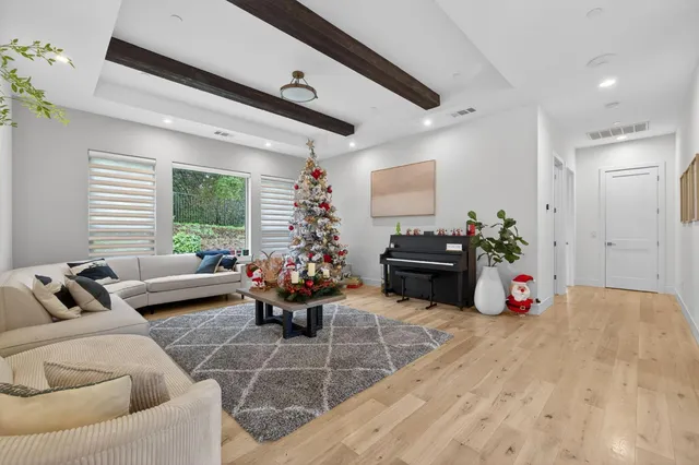 a living room with fireplace furniture and a wooden floor