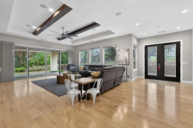 a kitchen with stainless steel appliances granite countertop a stove and a wooden floors