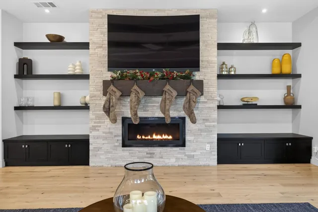 a bedroom with a bed and glass windows