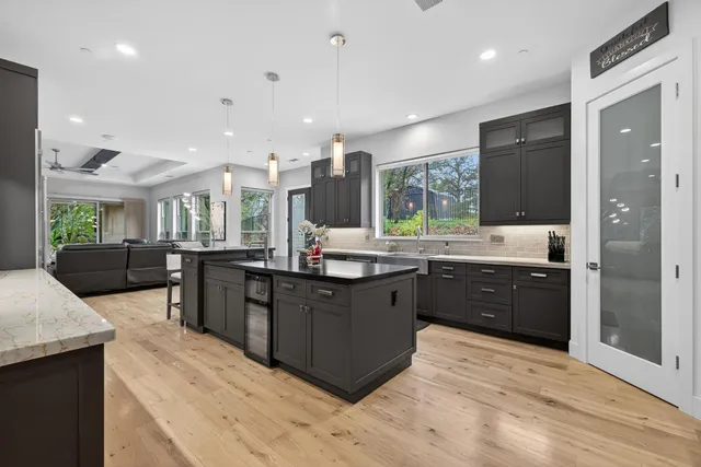 a spacious bedroom with a bed and a large mirror