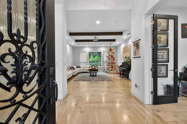 a view of a dining room with furniture wooden floor and chandelier