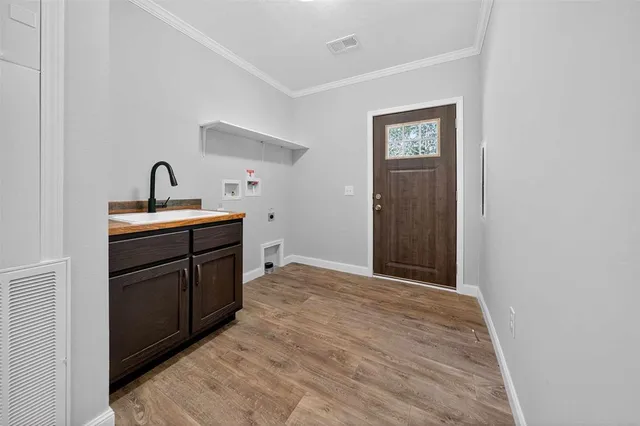 a room with a sink and a mirror