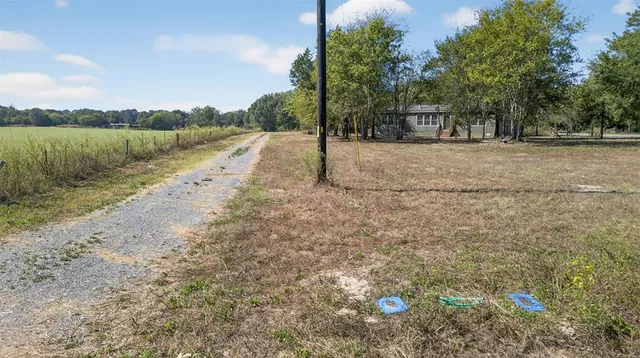 a view of a road with a yard