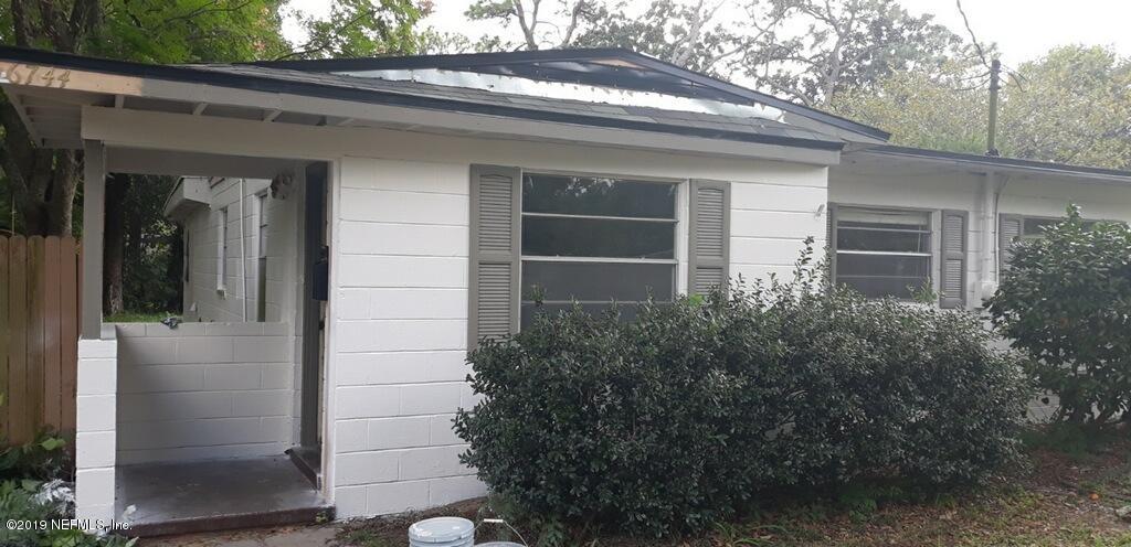 6744 Gamewell Road Jacksonville, FL 32211 - Photo 1 of 14 a front view of a house with a yard