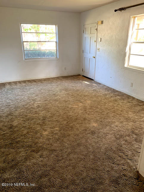 6744 Gamewell Road Jacksonville, FL 32211 - Photo 11 of 14 an empty room with window