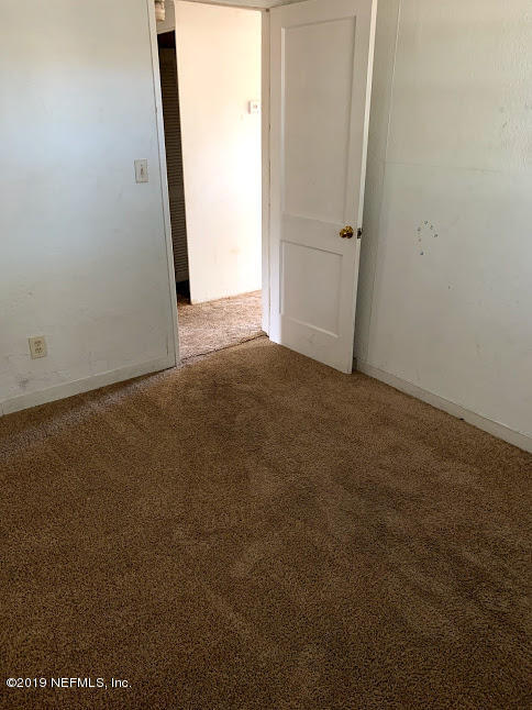 6744 Gamewell Road Jacksonville, FL 32211 - Photo 7 of 14 an empty room with window