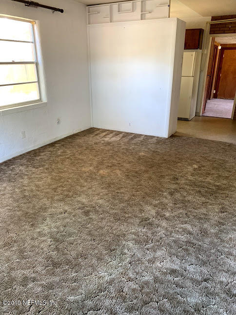 6744 Gamewell Road Jacksonville, FL 32211 - Photo 9 of 14 an empty room with window